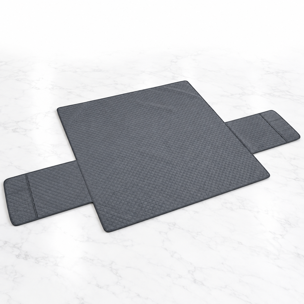 Grey waterproof three-seater sofa cover laid flat on light marble