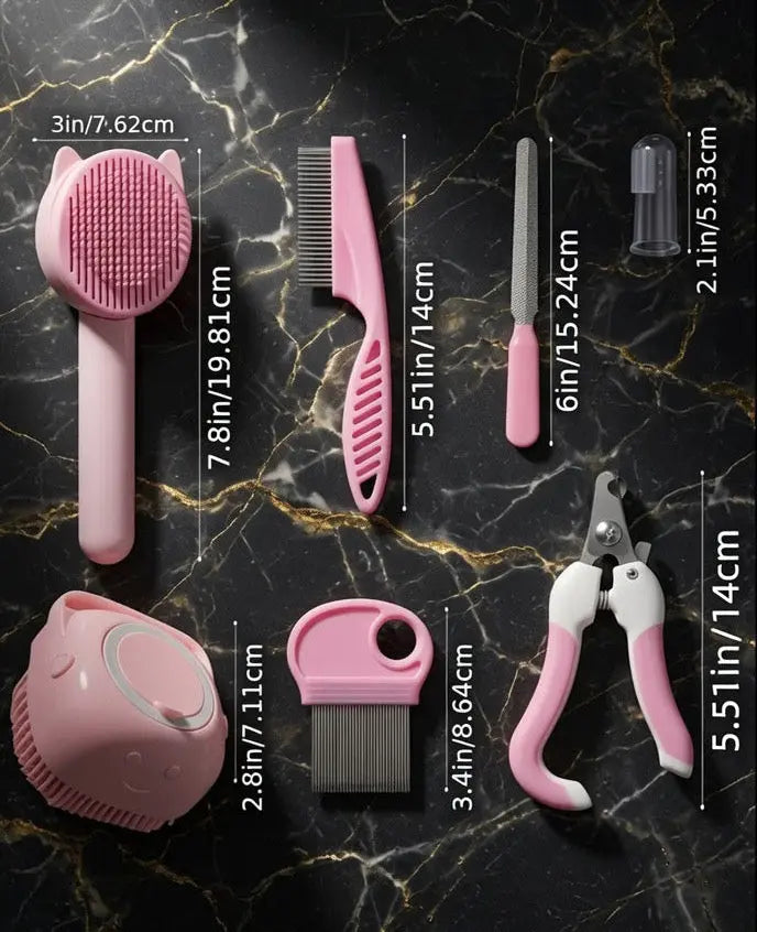 The Cashmere Comb grooming set laid out with brushes, combs, clippers and finger toothbrushes