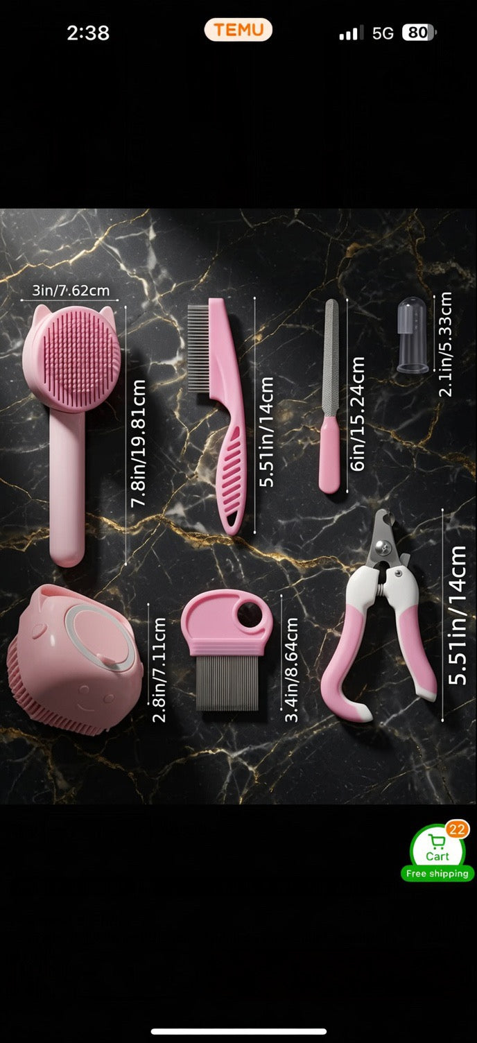 The Cashmere Comb grooming set laid out showing clippers, combs and bath brush