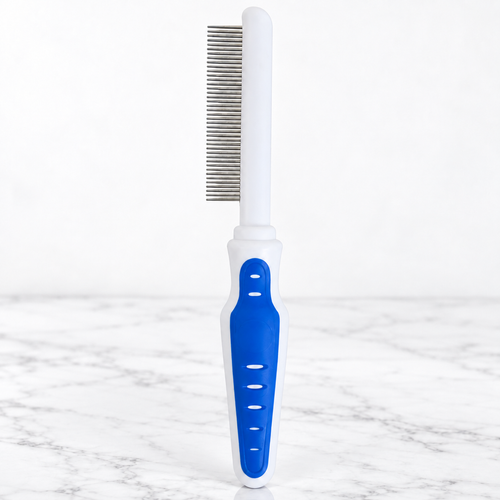 Cat Grooming Comb with Comfort Grip on white marble
