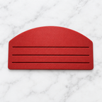 Red three-slot food pouch squeezer on white marble