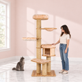 Wooden Cat Tree 191 cm – The Linden Lookout in an empty light pink room with white marble flooring and a smoky grey Maine Coon looking toward the product.