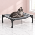 Elevated Cat Hammock Bed – The Airy Nest, Default Title shown, with a smoky grey Maine Coon in an empty light pink room.