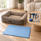 Grooming set, taupe bed and blue quilted mat in a bright living room