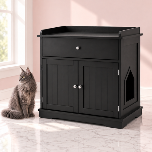 Cat Litter Box Cabinet 74 cm | Drawer – The Regent Litter Cabinet, Black shown with a smoky-grey Maine Coon in an empty light pink room.