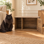 Oak-look litter cabinet with single slatted door open beside a full-size black Norwegian Forest Cat
