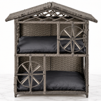 Grey two-storey wicker cat house with two removable cushions on a light marble background
