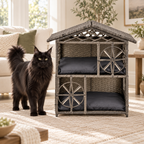 Grey two-storey wicker cat house beside a realistically sized black Maine Coon in a bright living room