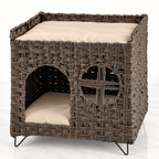 The Foldaway Wicker House on a pale white-marble studio floor