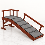 Brown wooden pet ramp with grey non-slip surface and guardrails on a light marble background