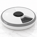 Six-meal automatic cat feeder on light white marble