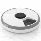 Six-meal automatic cat feeder on light white marble