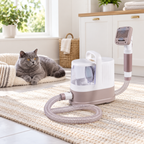 Unplugged 1.3 litre grooming vacuum with one grooming head and a blue British Shorthair safely behind