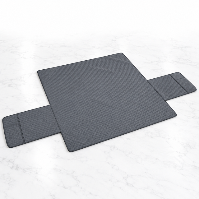 Grey waterproof three-seater sofa cover laid flat on light marble