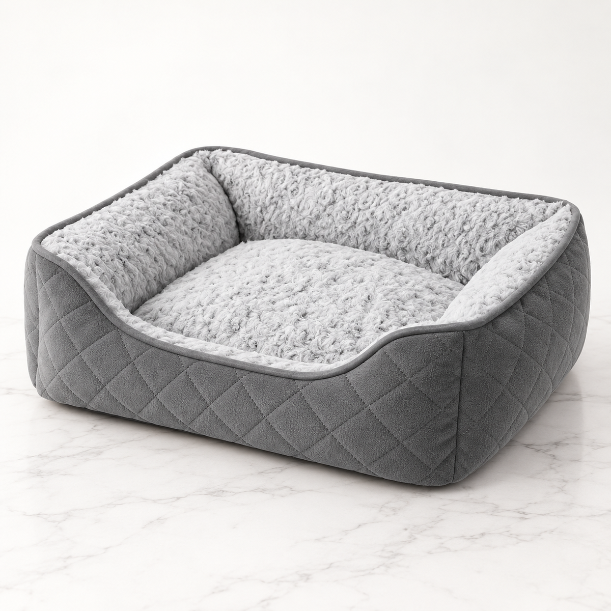 Silver Velvet Nest grey quilted cat bed with silver plush lining on white marble